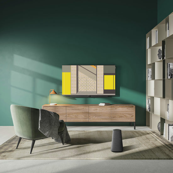 Animated mockup of the Ordre Minimal wallpaper collection displayed on a TV in a sophisticated living room with dark green walls. On the screen, a slideshow of the "Place d'Armes: The Brutalist Gateway" illustration cycles through its twelve different colour themes, including the authentic Classic '66, the warm Notre Nocturne, and the cool, aquatic Le Fleuve.